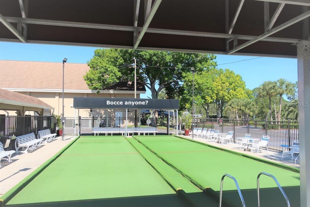 3681 Ridgemont Court Palm Harbor, FL 34684 - Photo 58 of 81 a view of a patio with a table and chairs under an umbrella