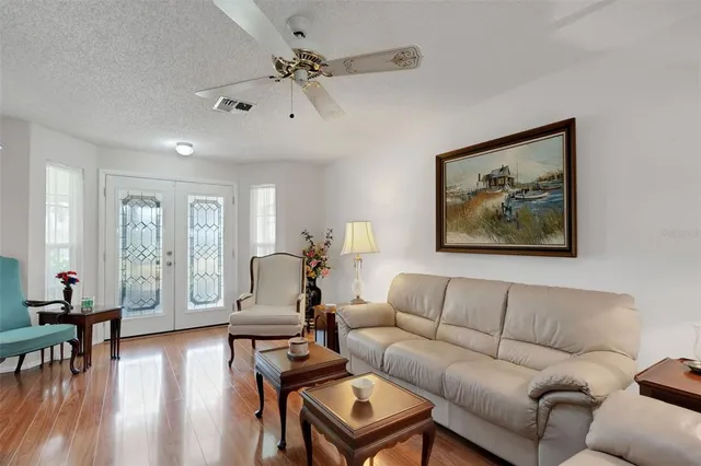 a dining room with furniture and wooden floor