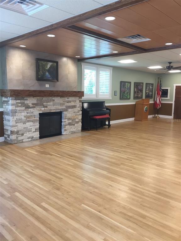 3681 Ridgemont Court Palm Harbor, FL 34684 - Photo 73 of 81 a large room with lots of wooden floor and a fireplace