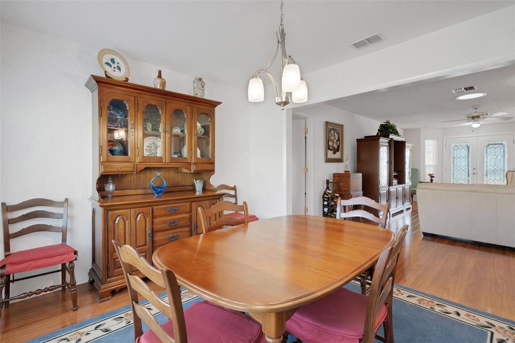 3681 Ridgemont Court Palm Harbor, FL 34684 - Photo 10 of 81 a dining room with furniture and wooden floor