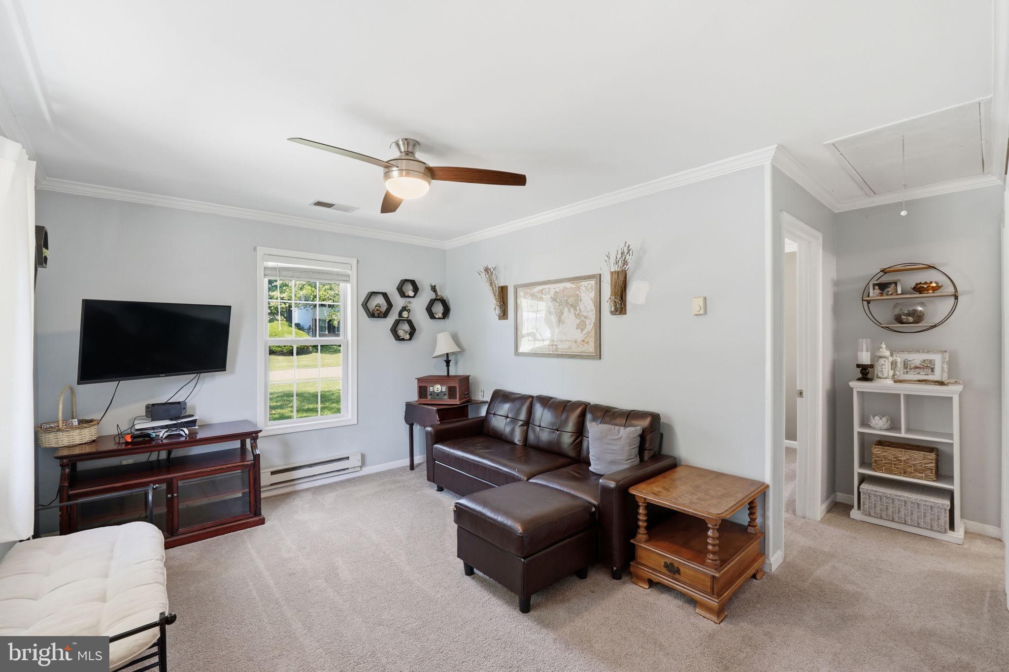 19608 Gott Street Poolesville, MD 20837 - Photo 13 of 43 a living room with furniture and a flat screen tv