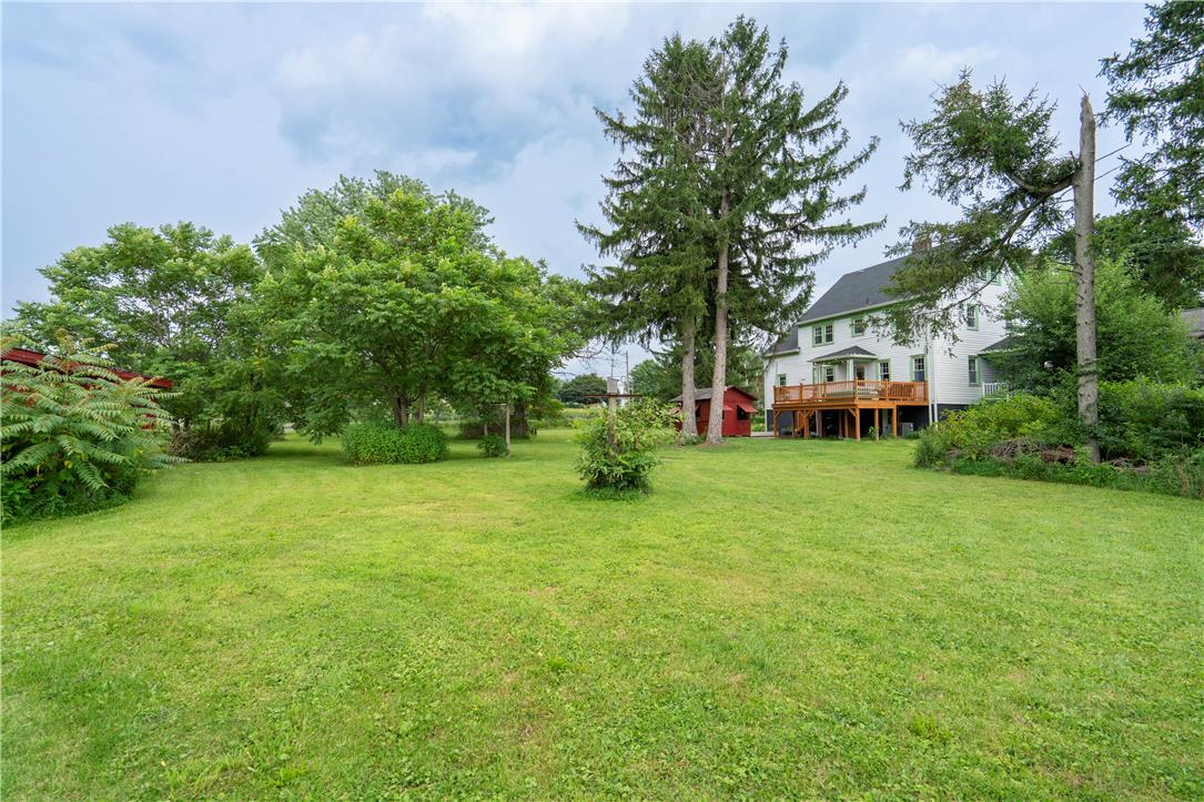 665 Point Phillips Road Bath, PA 18014 - Photo 57 of 73 A spacious, verdant yard provides ample outdoor living space behind a charming home with an elevated deck.