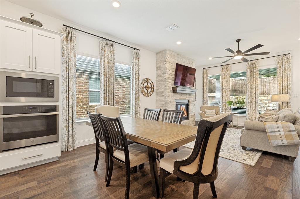 229 Savannah Lane Oak Point, TX 75068 - Photo 7 of 26 a view of a dining room with furniture window and wooden floor