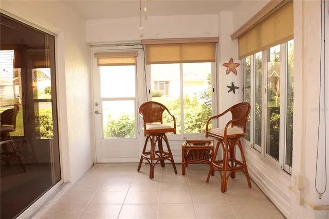 a view of a room with table and chairs