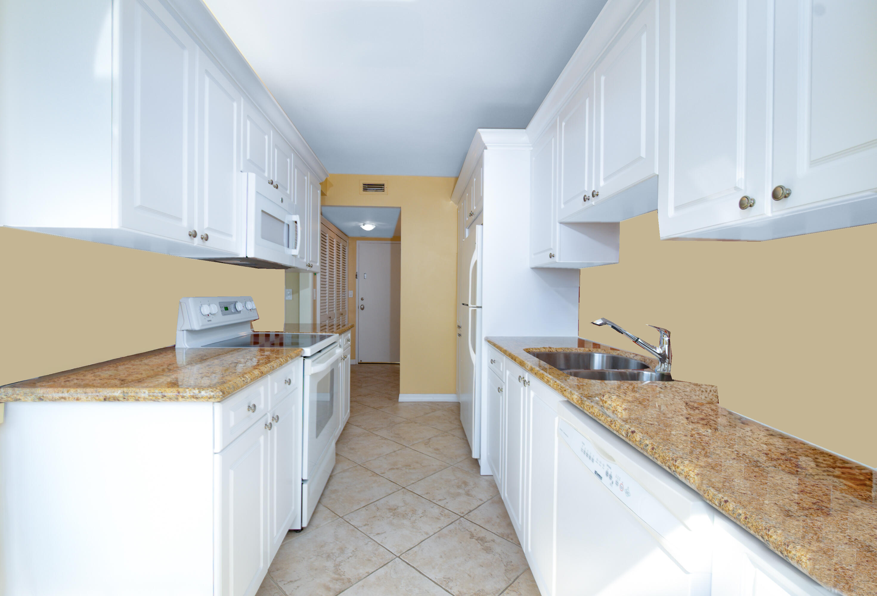 1200 South Ocean Boulevard, Unit 11D Boca Raton, FL 33432 - Photo 13 of 45 a kitchen with granite countertop a sink stove and cabinets