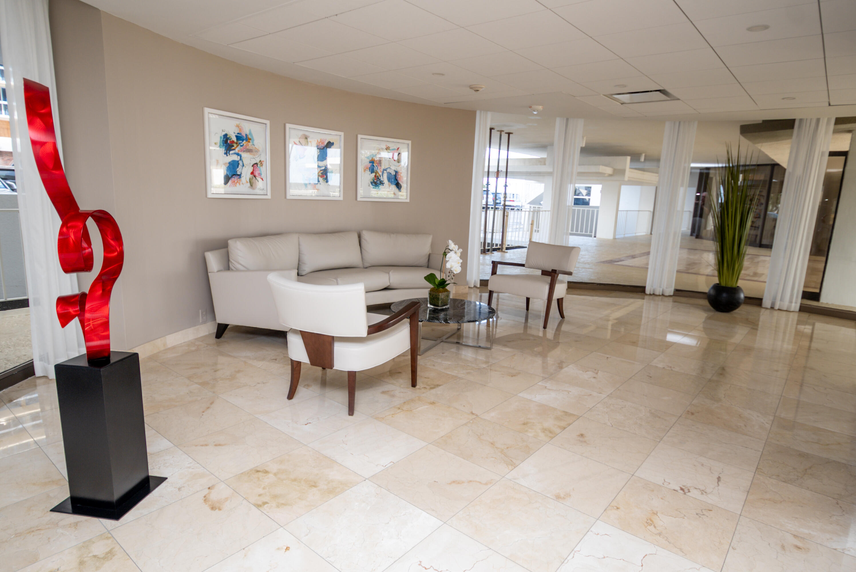 1200 South Ocean Boulevard, Unit 11D Boca Raton, FL 33432 - Photo 17 of 45 a living room with furniture and a gym