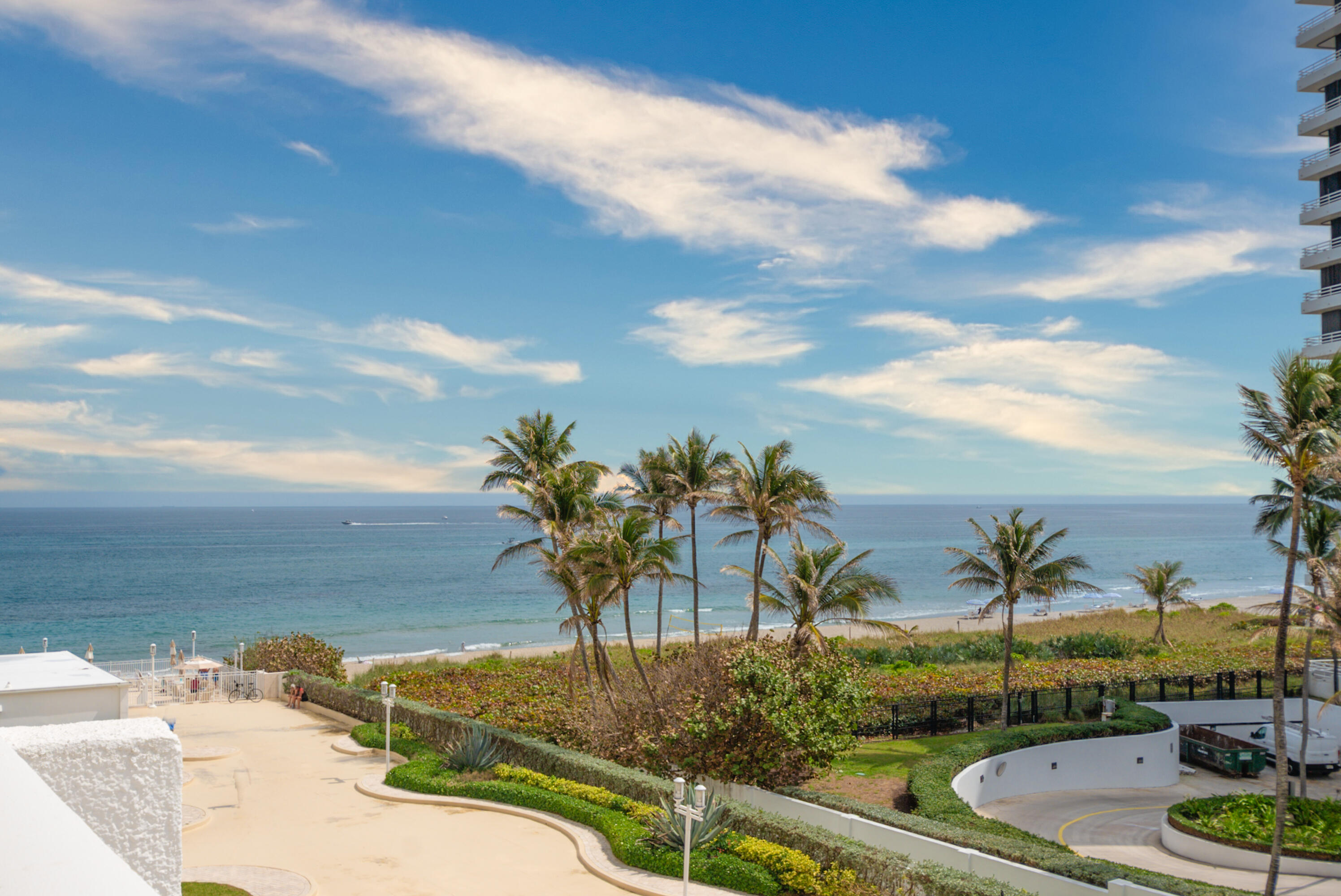 1200 South Ocean Boulevard, Unit 11D Boca Raton, FL 33432 - Photo 18 of 45 a view of a swimming pool with a table and chairs