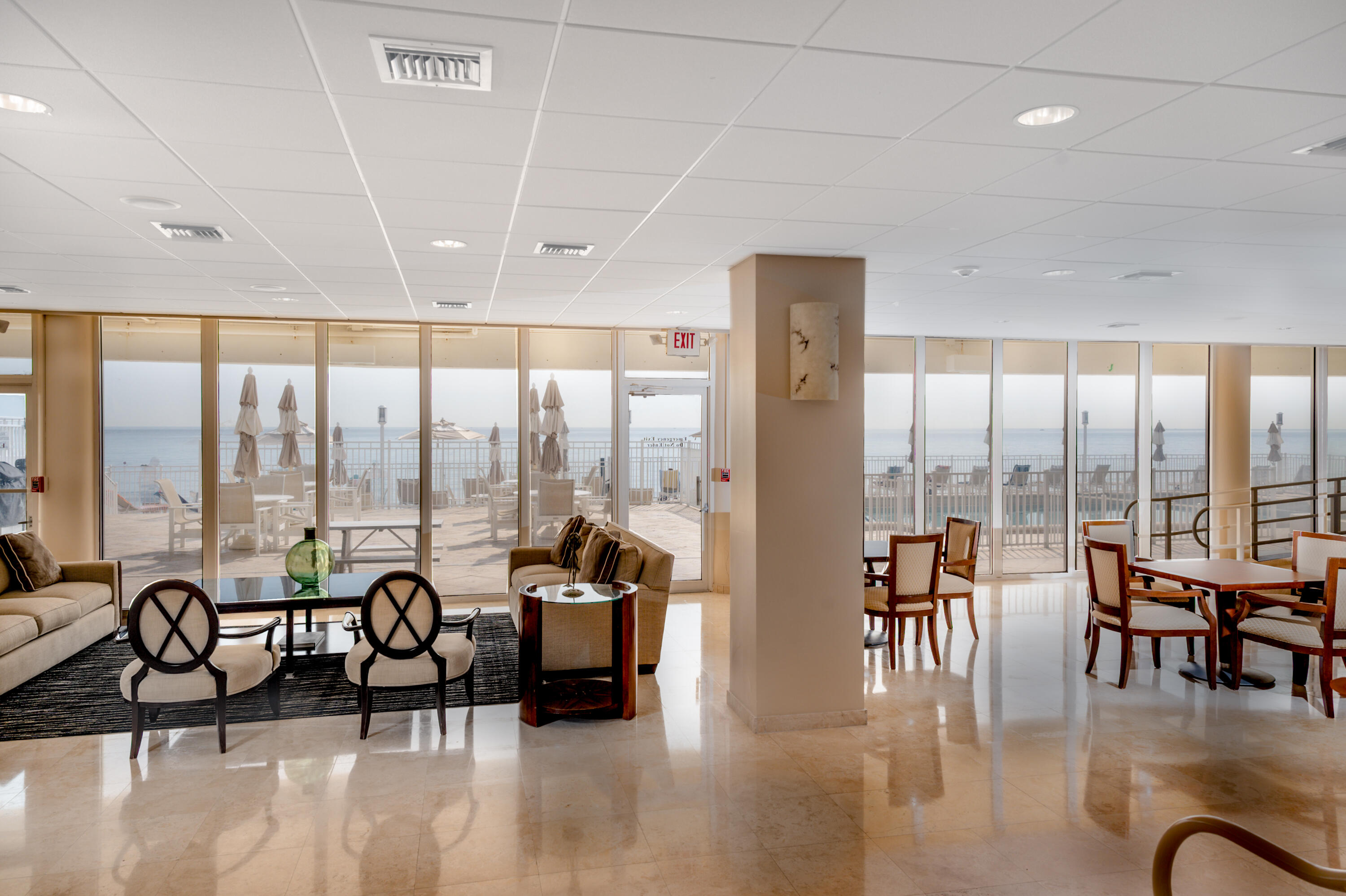 1200 South Ocean Boulevard, Unit 11D Boca Raton, FL 33432 - Photo 22 of 45 a living room with furniture and floor to ceiling windows