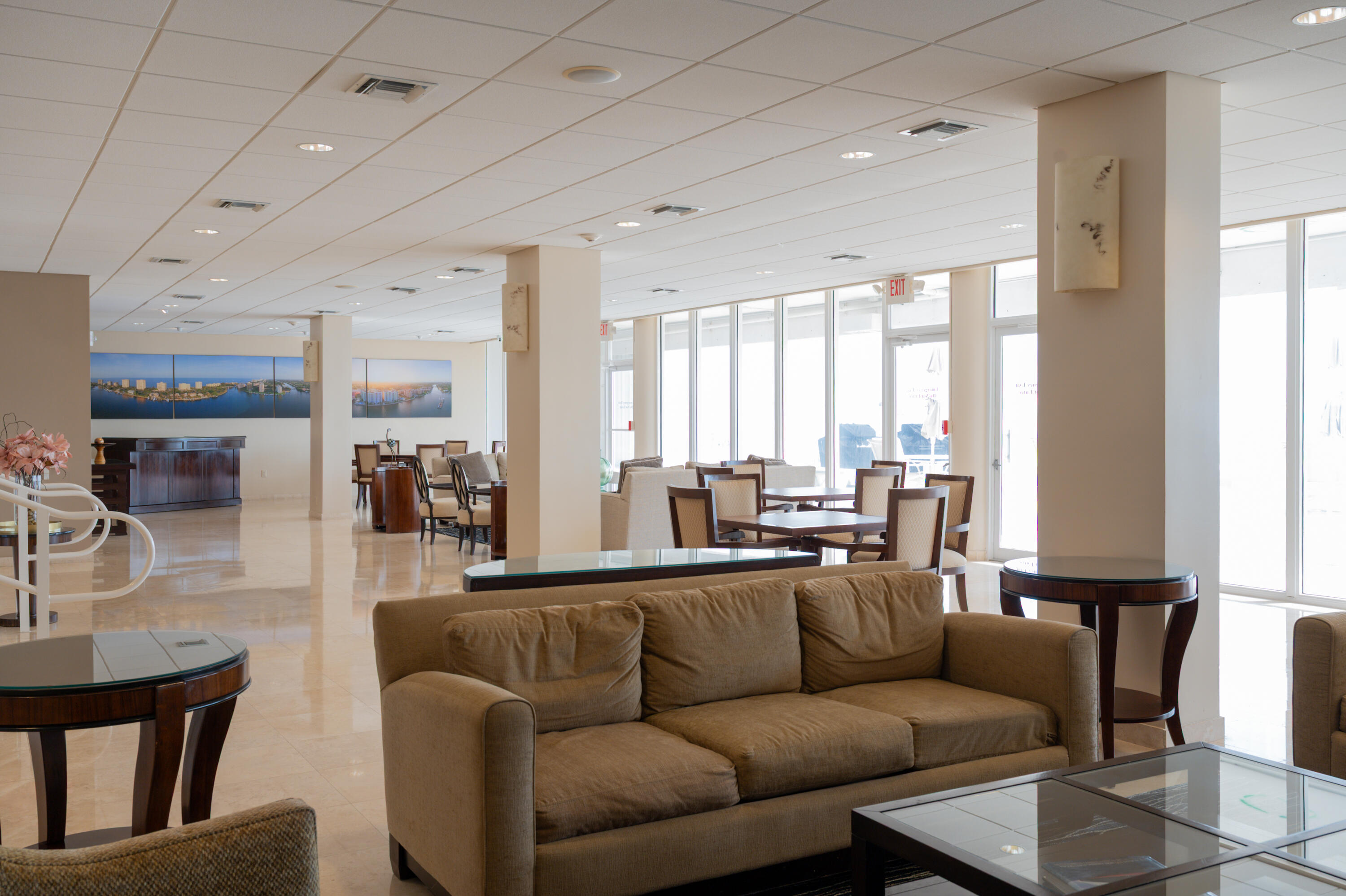 1200 South Ocean Boulevard, Unit 11D Boca Raton, FL 33432 - Photo 23 of 45 a living room with furniture wooden floor and a large window
