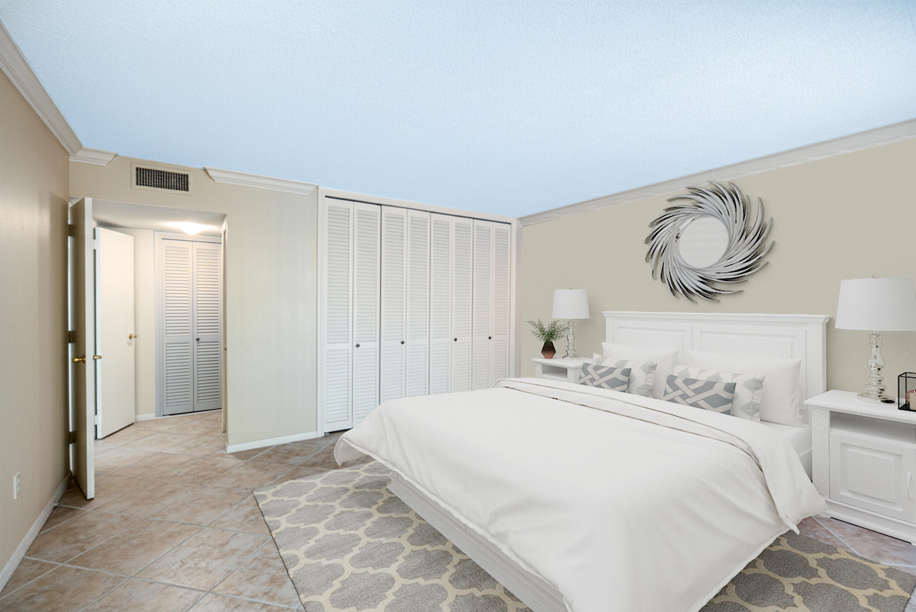 1200 South Ocean Boulevard, Unit 11D Boca Raton, FL 33432 - Photo 6 of 45 a bedroom with a bed and a lamp on dresser