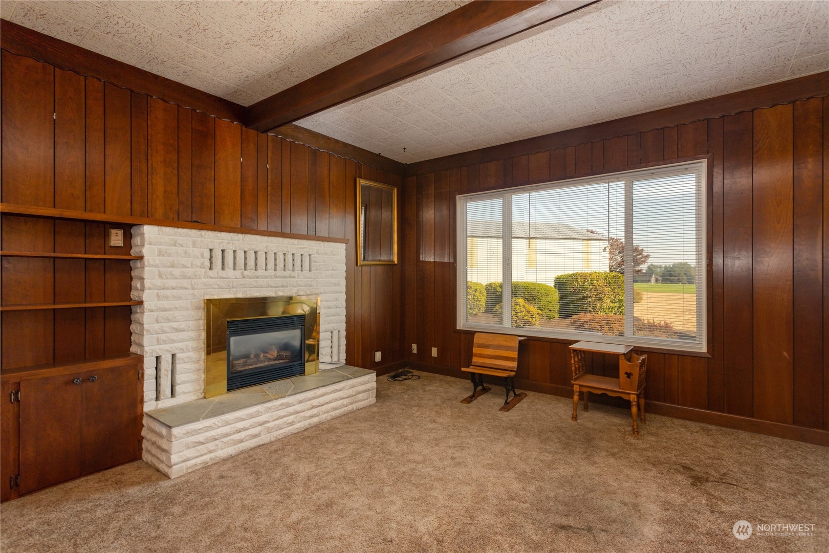7992 Flynn Road Lynden, WA 98264 - Photo 11 of 39 a living room with furniture a fireplace and a window