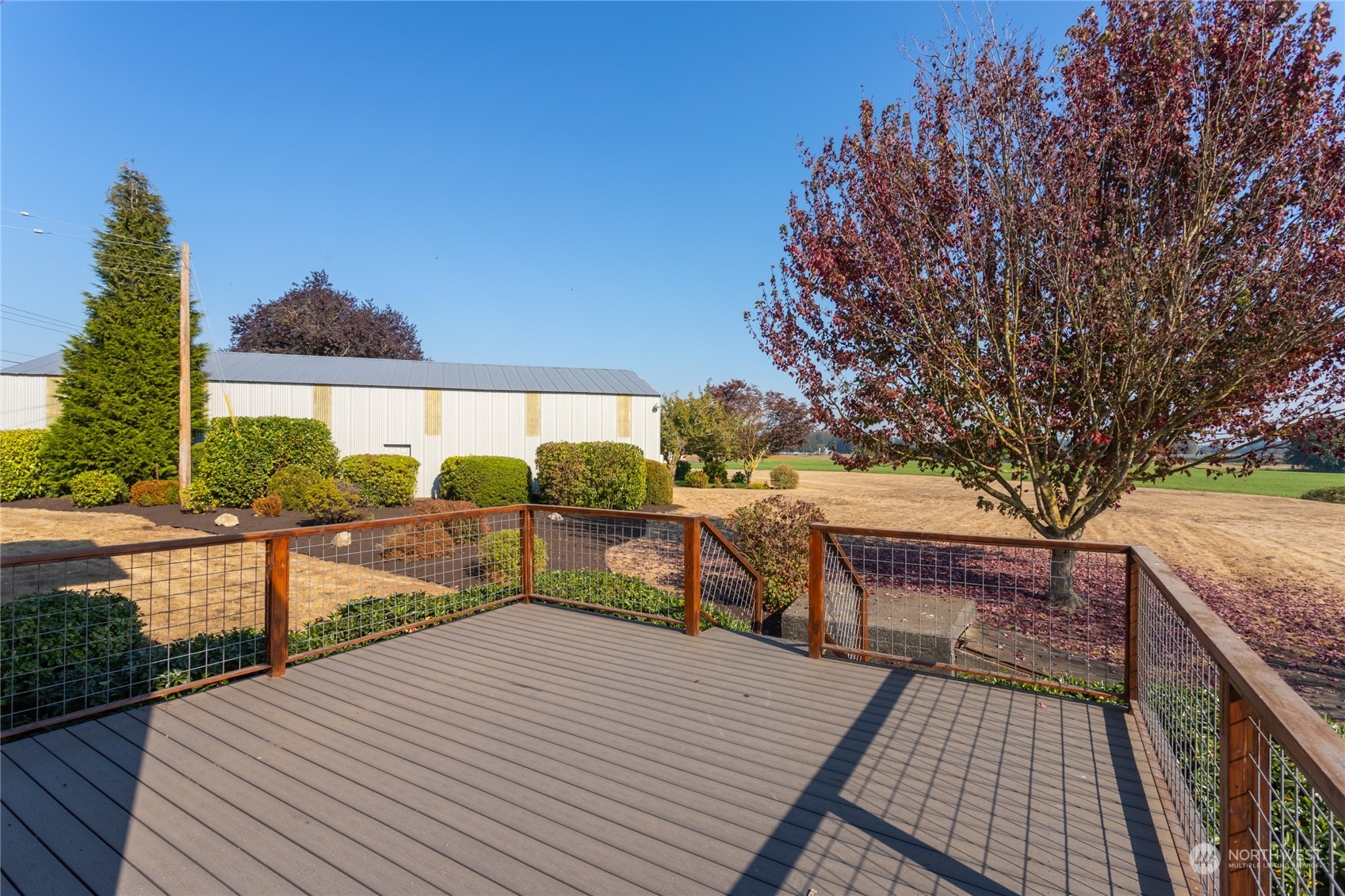 7992 Flynn Road Lynden, WA 98264 - Photo 24 of 39 a view of balcony with wooden floor and outdoor seating