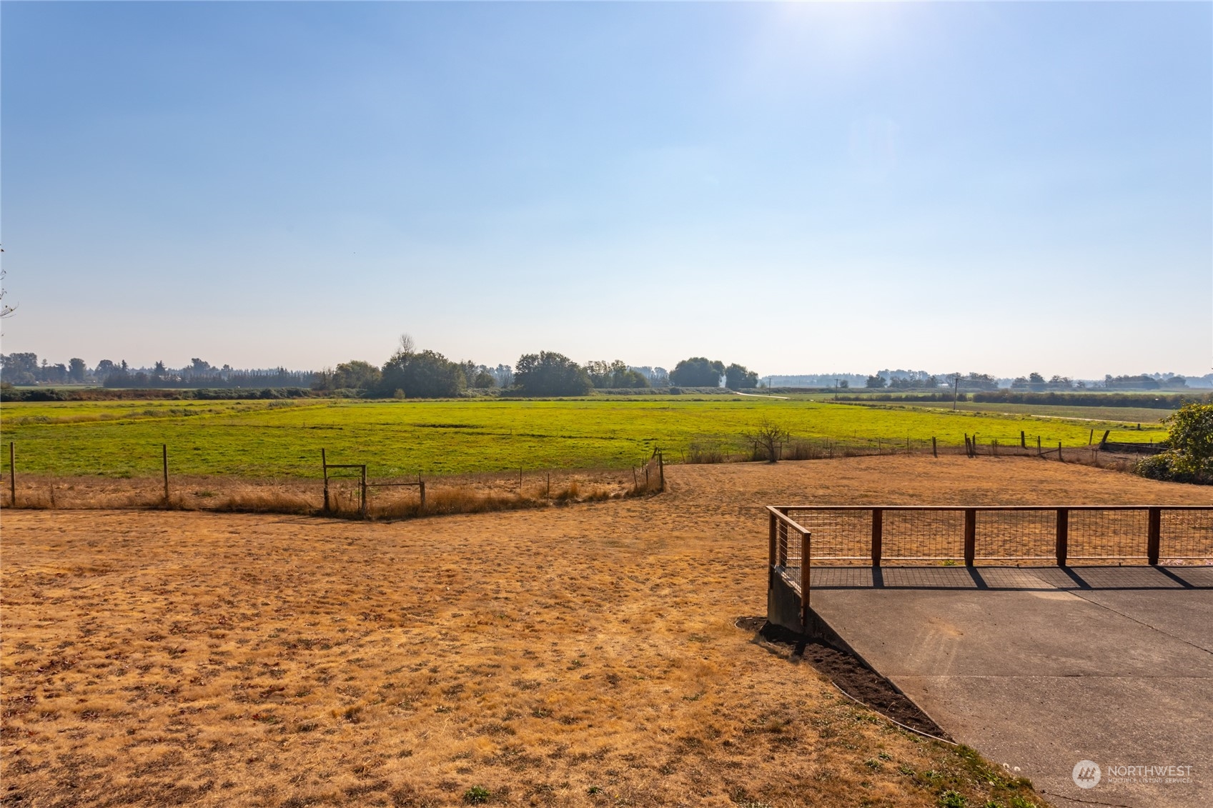 7992 Flynn Road Lynden, WA 98264 - Photo 26 of 39 a view of a lake with outdoor space and a bench in ocean
