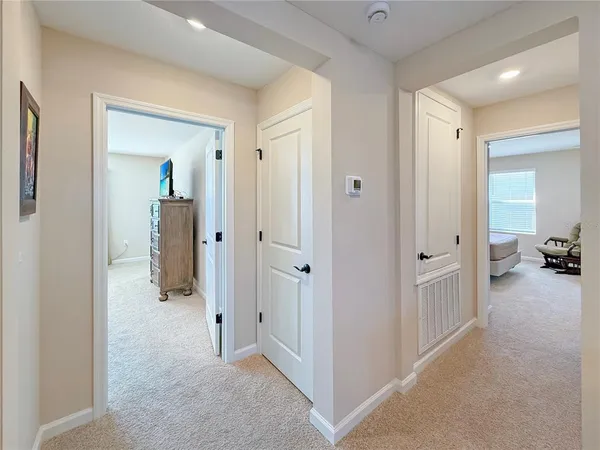 a bedroom with a bed and a chair