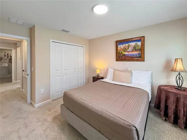 a bedroom with furniture and a window