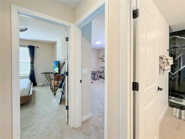 a bathroom with a sink vanity mirror and toilet
