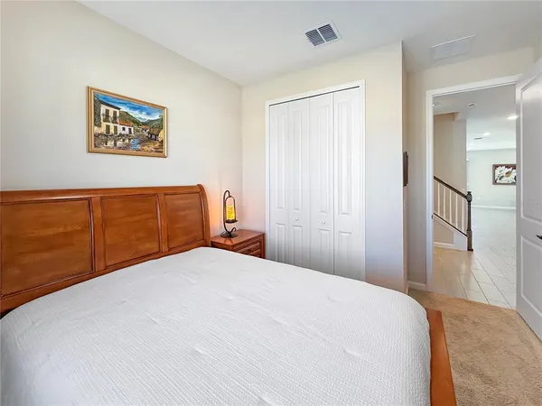 a kitchen with kitchen island granite countertop a sink a counter top space stainless steel appliances and cabinets