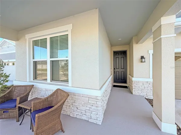 a view of room with furniture and windows