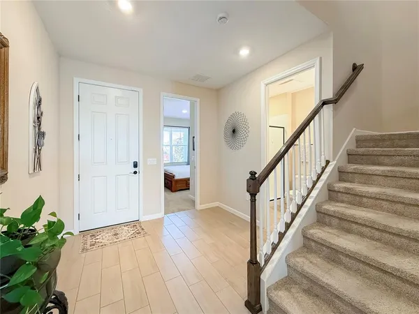 a view of an entryway with wooden floor