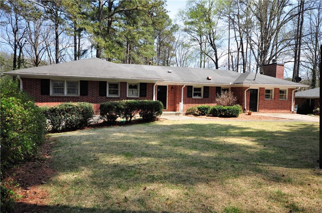 1617 Tamarack Trail Decatur, GA 30033 - Photo 1 of 1 a front view of a house with garden