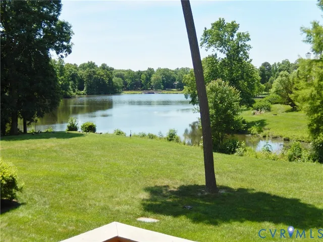 a view of a lake with a yard