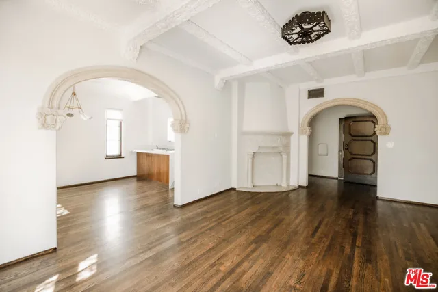 a view of a livingroom with wooden floor