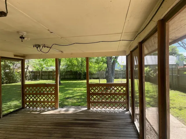 a view of a glass door of the house