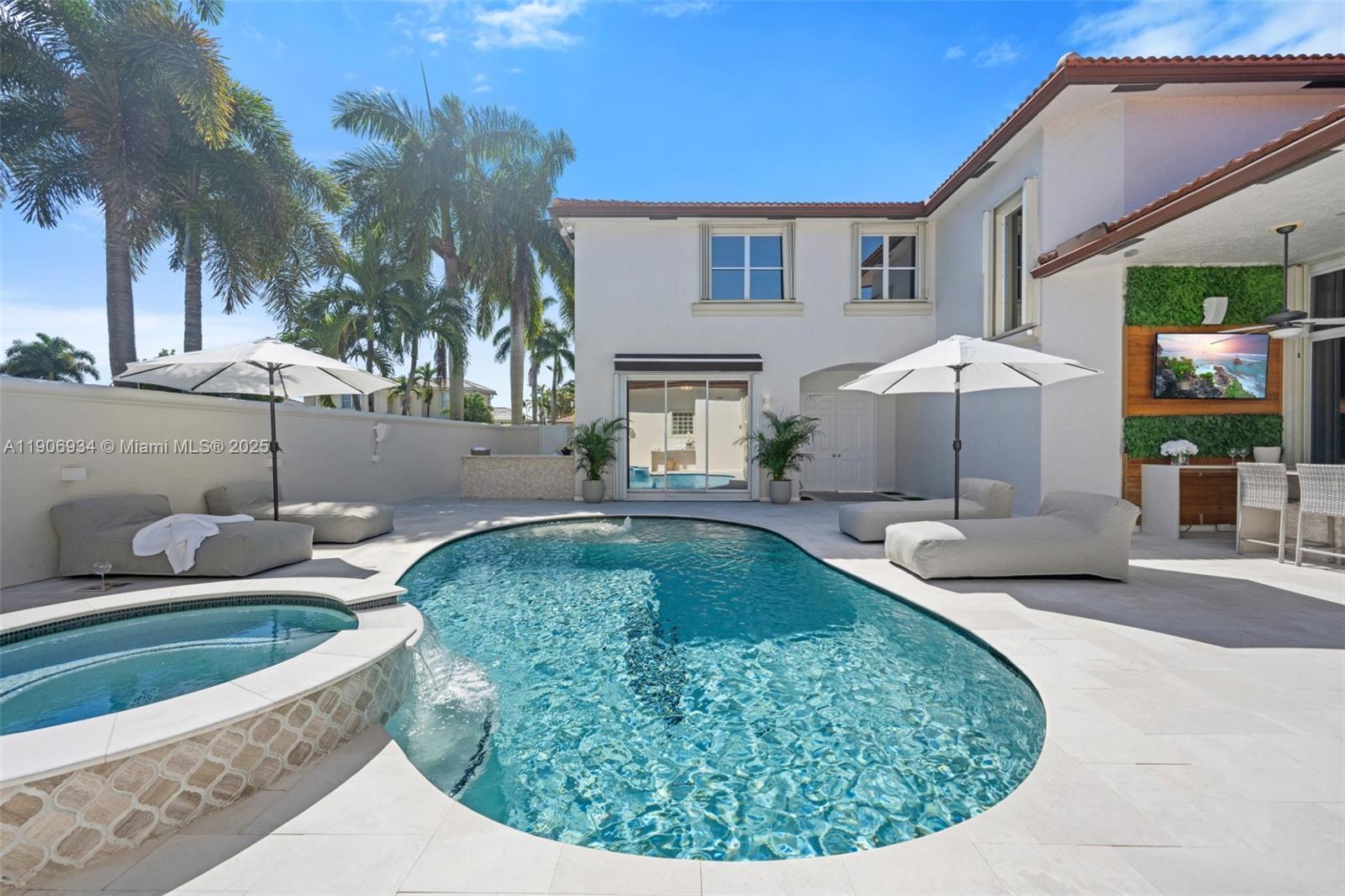 18715 Ocean Mist Drive Boca Raton, FL 33498 - Photo 34 of 44 a view of a house with swimming pool