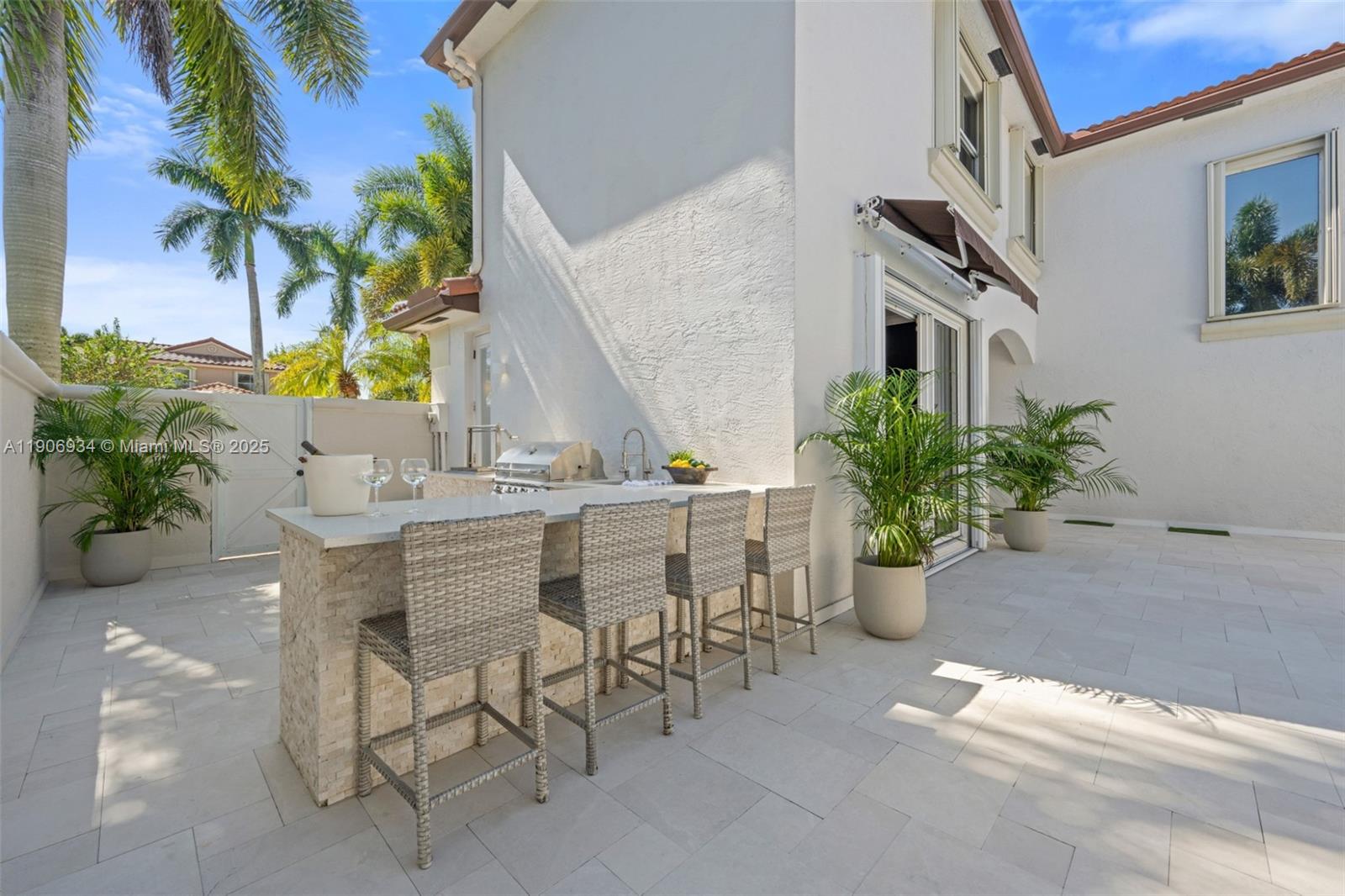 18715 Ocean Mist Drive Boca Raton, FL 33498 - Photo 36 of 44 a view of a chairs and table in a patio