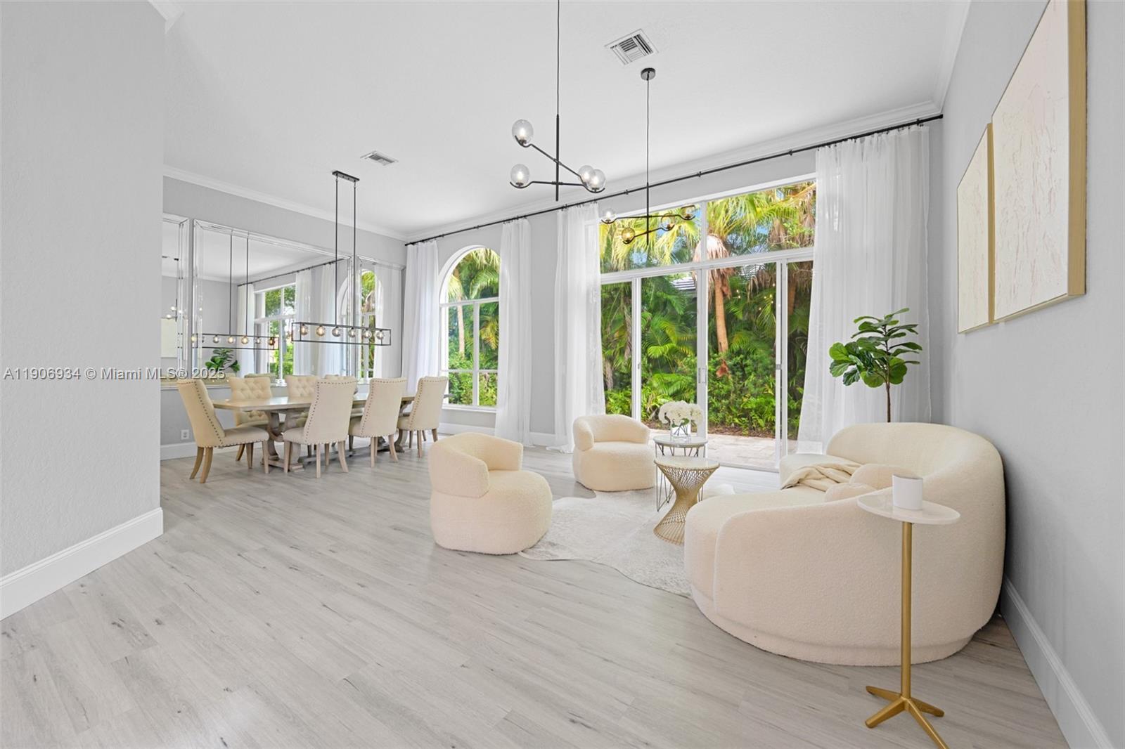18715 Ocean Mist Drive Boca Raton, FL 33498 - Photo 4 of 44 a living room with furniture and a large window