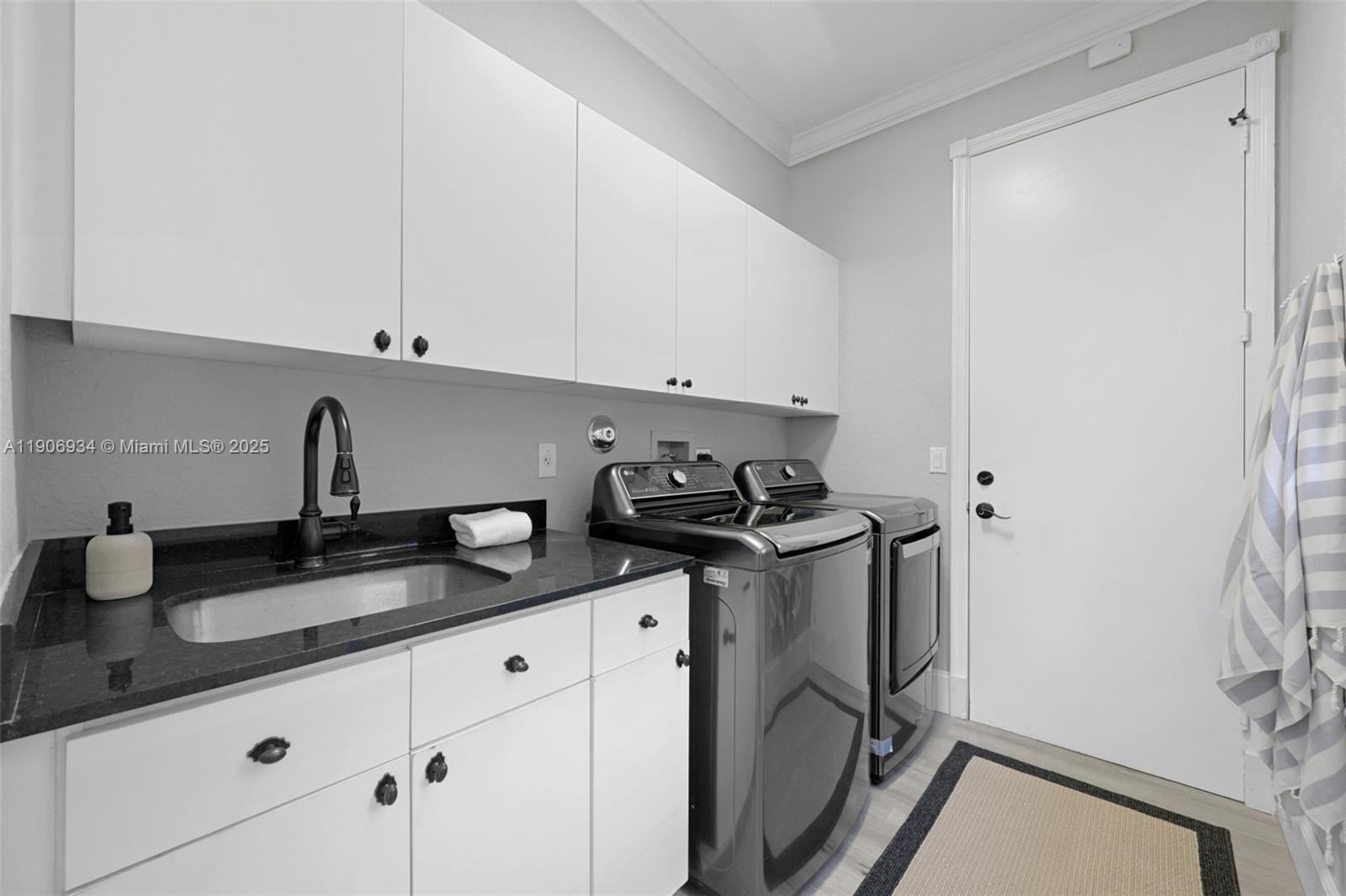 18715 Ocean Mist Drive Boca Raton, FL 33498 - Photo 41 of 44 a kitchen with stainless steel appliances granite countertop a sink stove and cabinets