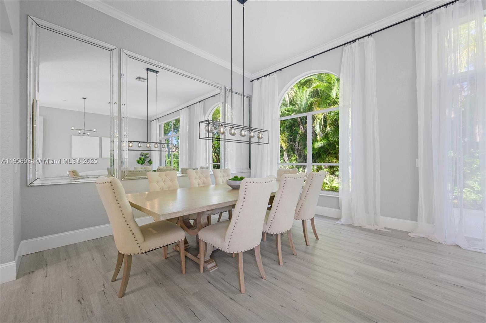 18715 Ocean Mist Drive Boca Raton, FL 33498 - Photo 6 of 44 a view of a dining room with furniture window and wooden floor