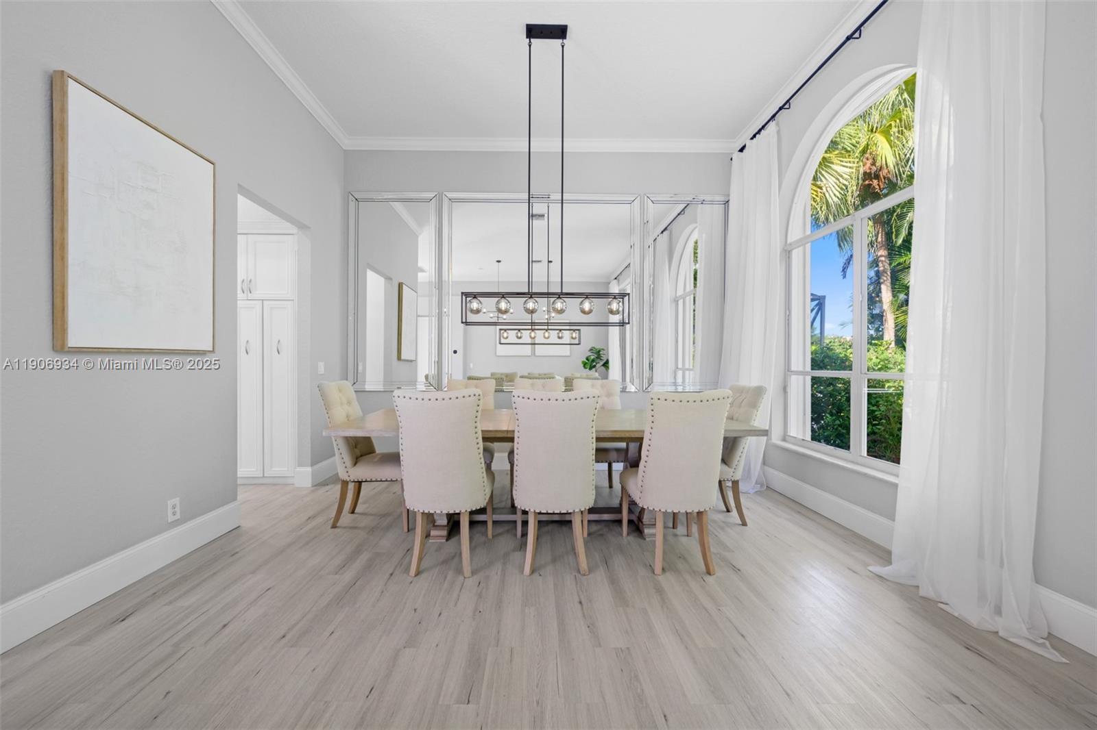 18715 Ocean Mist Drive Boca Raton, FL 33498 - Photo 7 of 44 a view of a dining room with furniture window and wooden floor