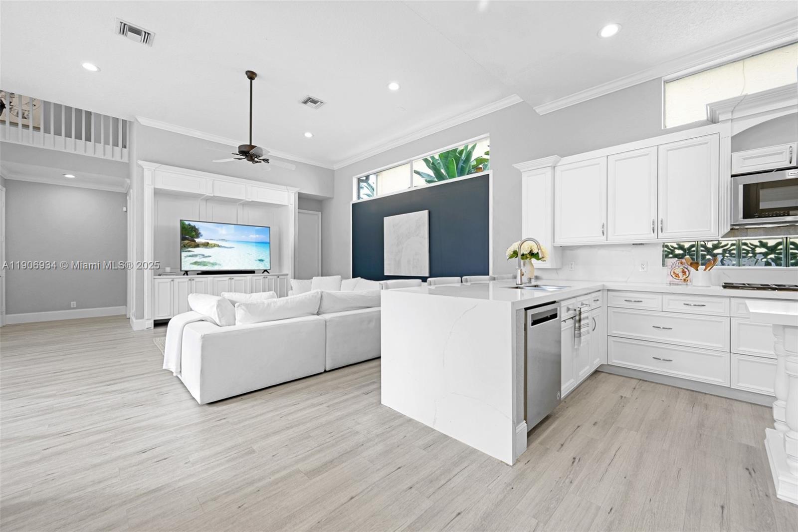 18715 Ocean Mist Drive Boca Raton, FL 33498 - Photo 8 of 44 a kitchen with cabinets a sink and a stove