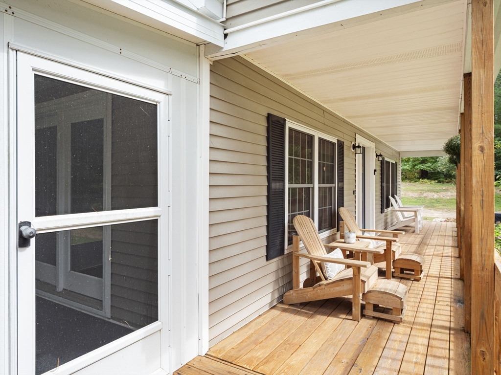 83 Lake Street Acushnet, MA 02743 - Photo 17 of 39 a balcony with table and chairs