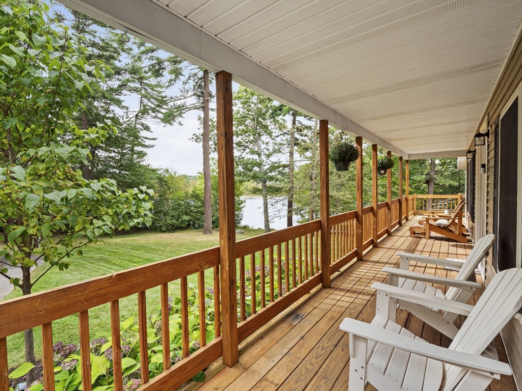 83 Lake Street Acushnet, MA 02743 - Photo 4 of 39 a view of a two room with wooden floor and iron stairs