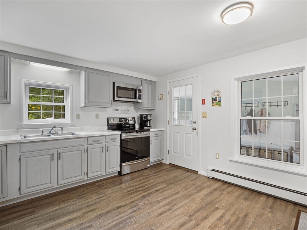 83 Lake Street Acushnet, MA 02743 - Photo 6 of 39 a kitchen with stainless steel appliances granite countertop a stove and a sink