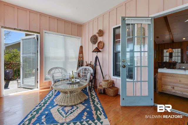 30234 River Road Orange Beach, AL 36561 - Photo 13 of 23 The sun room spans the width of the great room, lots of windows for those amazing views and has mini-split for heating & cooling.