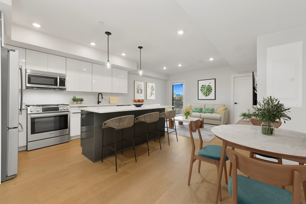 a kitchen with a sink cabinets and stainless steel appliances