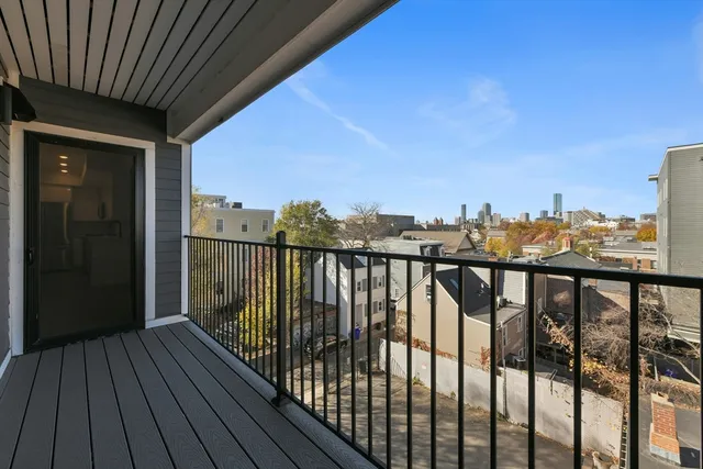 a view of a balcony with wooden floor
