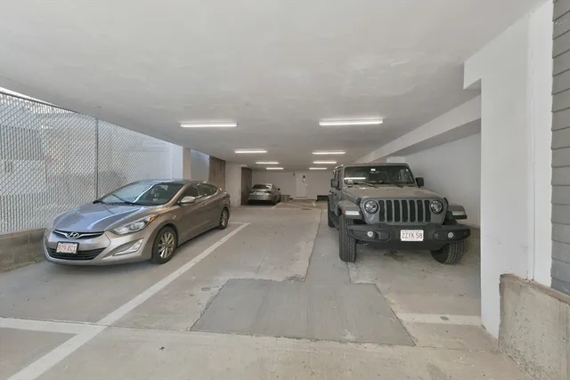 a view of parking space with cars parked