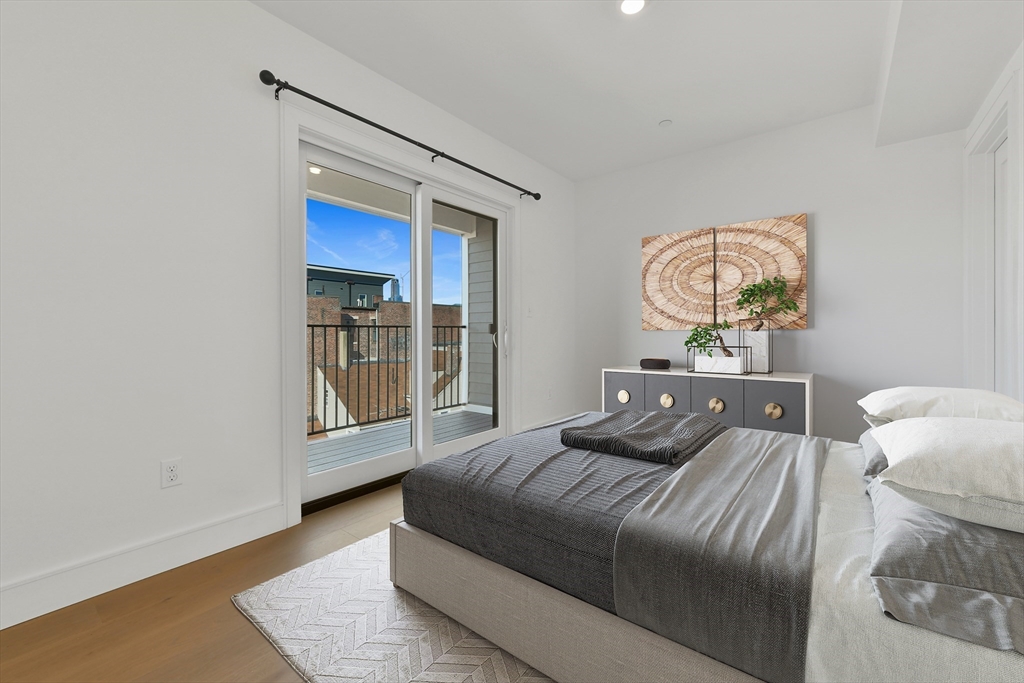 321 West Broadway, Unit 6 Boston, MA 02127 - Photo 8 of 20 a bedroom with a bed and a window