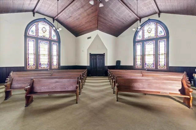 a view of a kitchen with furniture and chandelier