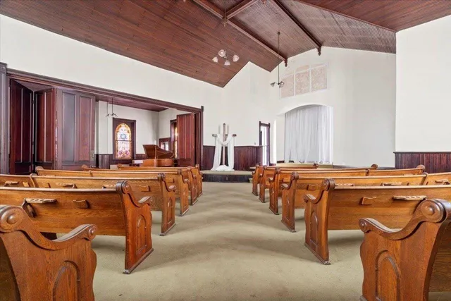 a kitchen with refrigerator cabinets and a sink