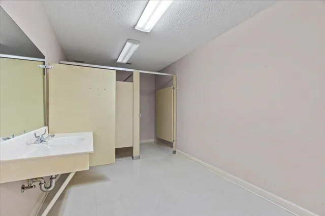 a bathroom with a sink double vanity and a mirror
