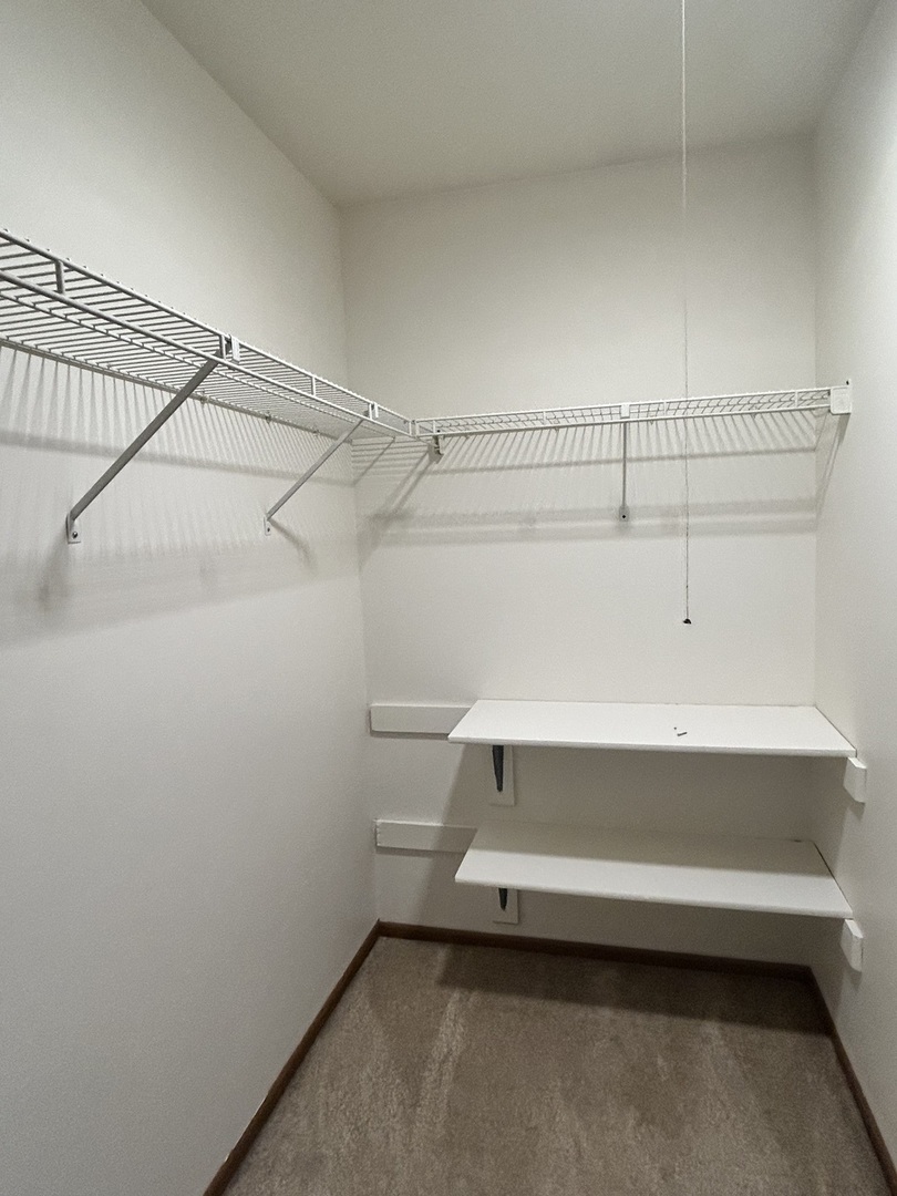 422 Lincoln Avenue, Unit A Fox River Grove, IL 60021 - Photo 11 of 15 a view of a room with racks on the wall