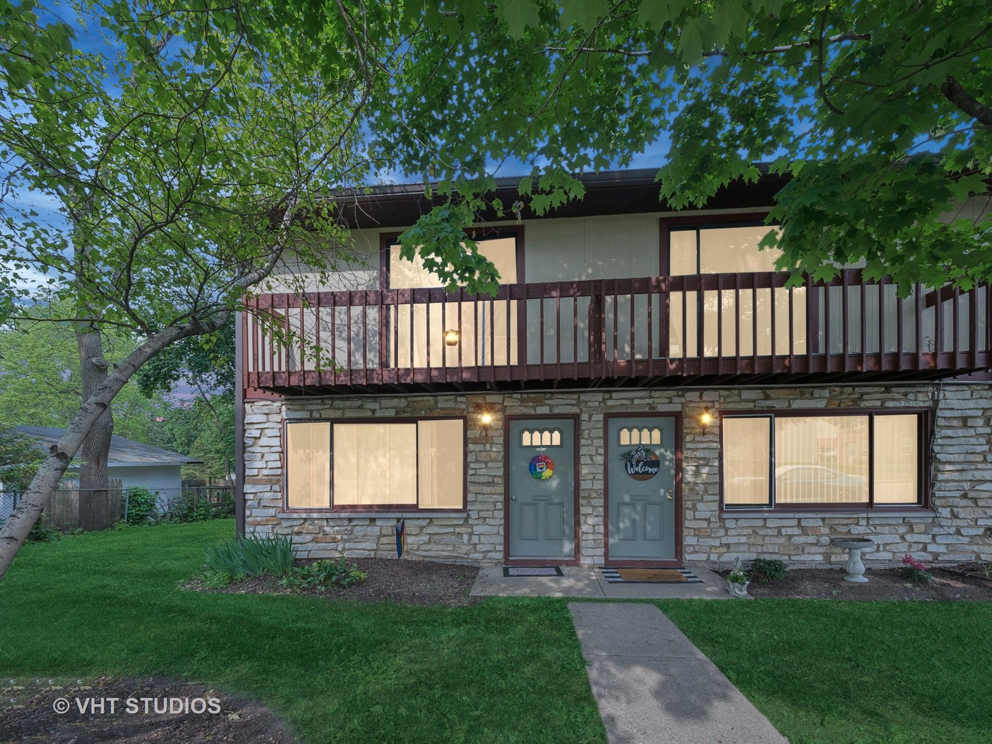 422 Lincoln Avenue, Unit A Fox River Grove, IL 60021 - Photo 15 of 15 a view of a house with a small yard and a large tree