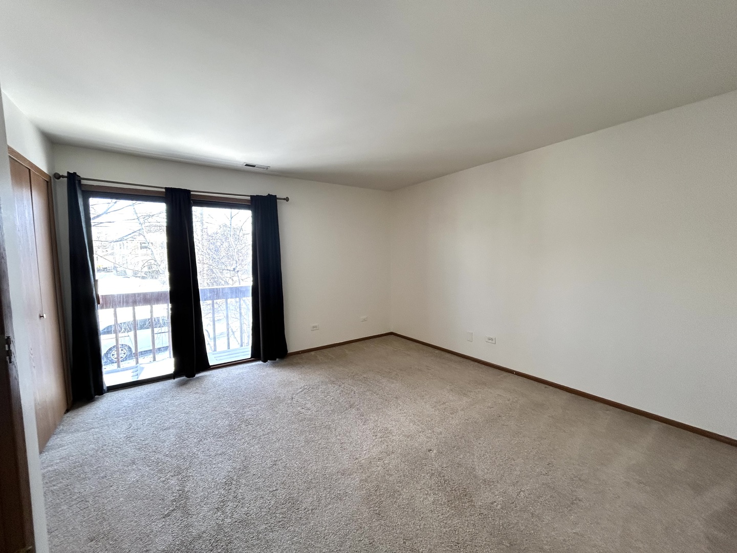 422 Lincoln Avenue, Unit A Fox River Grove, IL 60021 - Photo 10 of 15 an empty room with windows