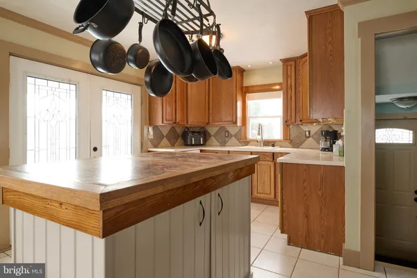 a kitchen with a stove and a sink