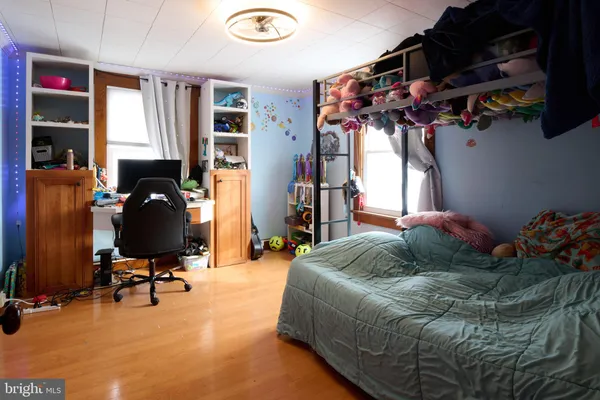 a bedroom with bed and a window